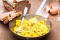 Old pan with  fresh scrambled eggs Royalty Free Stock Photo