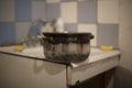 Old pan on sink. Dishes in kitchen. Old kitchen in house Royalty Free Stock Photo