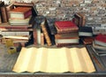 Old paper and ancient books on study table in medieval scene