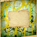 Old paper on the ancient graffiti wall Royalty Free Stock Photo