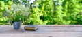 old paper book in black cover, family bible lie on wooden table in garden, beautiful blurred natural landscape in background with Royalty Free Stock Photo