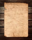 Old Paper on Brown Wood Texture Royalty Free Stock Photo