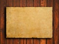 Old paper on brown wood texture with natural patte Royalty Free Stock Photo