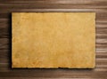 Old paper on brown wood texture with natural patte Royalty Free Stock Photo