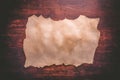 Old paper on brown wood texture with natural patterns Royalty Free Stock Photo
