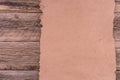 Old paper on brown wood texture with natural patterns. Royalty Free Stock Photo