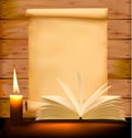 Old paper, candle and open book on wood background Royalty Free Stock Photo