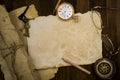 Old paper, compass, pocket watch on wooden background Royalty Free Stock Photo