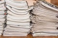 Old paper documents stacked in archive. Documents on the shelves of archive room. Office shelves in the closet full of files Royalty Free Stock Photo