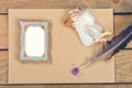 Old paper, feather, angel, frame on table Royalty Free Stock Photo