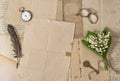 Old paper feather pen vintage accessories spring flowers Nostalgic background Royalty Free Stock Photo