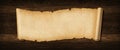 Old paper horizontal banner. Parchment scroll on a wood board Royalty Free Stock Photo