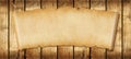 Old paper horizontal banner. Parchment scroll on a wood board Royalty Free Stock Photo