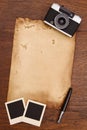 Old paper, ink pen and vintage photo frame with camera Royalty Free Stock Photo