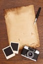 Old paper, ink pen and vintage photo frame with camera Royalty Free Stock Photo