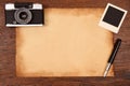 Old paper, ink pen and vintage photo frame with camera Royalty Free Stock Photo