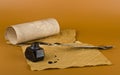 Old paper, inkwell and pen on a brown background close-up Royalty Free Stock Photo