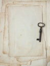 Old paper and key. Royalty Free Stock Photo