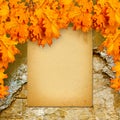 Old paper listing on old brick wall with bright orange leaves