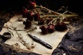 Old paper, pen, inkwell and dried roses on dark background, Sorrow\'s Remnants: Create an image that portrays the aftermath