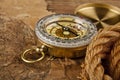 Old paper, rope and compass on a wooden table Royalty Free Stock Photo