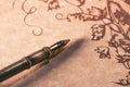 Old paper scroll and fountain pen with selective focus