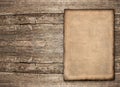 Old paper sheet over rustic wooden background Royalty Free Stock Photo