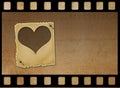 Old paper slides in the form of hearts on abstract background