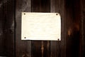 Old paper tacked to a wood wall Royalty Free Stock Photo