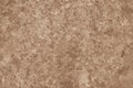 Old paper wall texture in spots. Abstract brown cardboard sheet background. Decorative uneven pattern. Aged dirty paper sheet. Cop Royalty Free Stock Photo