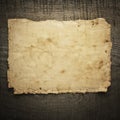Old paper on the wood background Royalty Free Stock Photo
