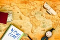 Old paper world map, as a travel background, and accessories for a photographer to work as a digital nomad Royalty Free Stock Photo