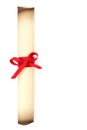 Old Parchment Scroll Tied with Red Ribbon Royalty Free Stock Photo