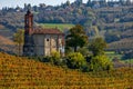 Old parish church among autumnal vineyards in Italy Royalty Free Stock Photo