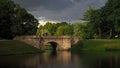 An old Park with a bridge in a thunderstorm. Gatchina. Russia. Royalty Free Stock Photo