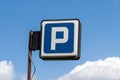 Old parking road sign with a blue sky background Royalty Free Stock Photo