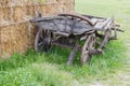 Old partly broken wooden four-wheeled horse-drawn rural wagon