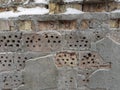 Old partly destroyed brick wall covered with hoarfrost and snow Royalty Free Stock Photo