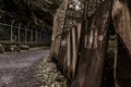 Rusty fences with a path between them forgotten place after a nuclear devastation