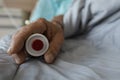 old patient hand with safety needle on back palm