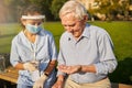 Old patient taking cure from a female doctor Royalty Free Stock Photo