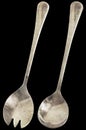 Old Patinated Stainless Steel Salad Fork And Spoon Isolated On Black Background