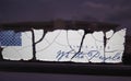 Vintage patriotic bumper sticker with cracks through it