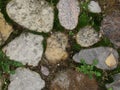 Background. fragment. texture. the old road is paved with wild stone, cobblestones. landscape design, natural style. Royalty Free Stock Photo