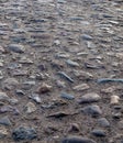 An old paving roadway. Road paved with cobblestones.