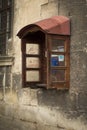 Old payphone on the stone wall Royalty Free Stock Photo