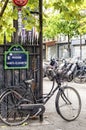 Old Pedal Bike In Paris With Old French Street Sign