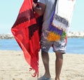 old peddler sales clothes on the beach