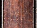 Old peeling brown paint on a wooden surface Royalty Free Stock Photo