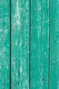 Old and peeling paint Over time, the green paint peeled off from the old boards and the wood texture cracked. Vintage Royalty Free Stock Photo